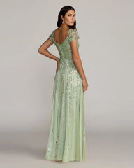 Green Sequined Evening Gown With Embellished Shoulders