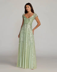 Green Sequined Evening Gown With Embellished Shoulders