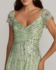 Green Sequined Evening Gown With Embellished Shoulders